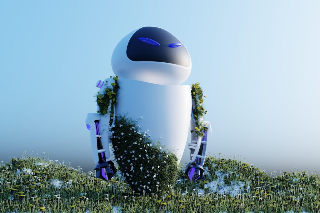 a robot sitting on top of a lush green field